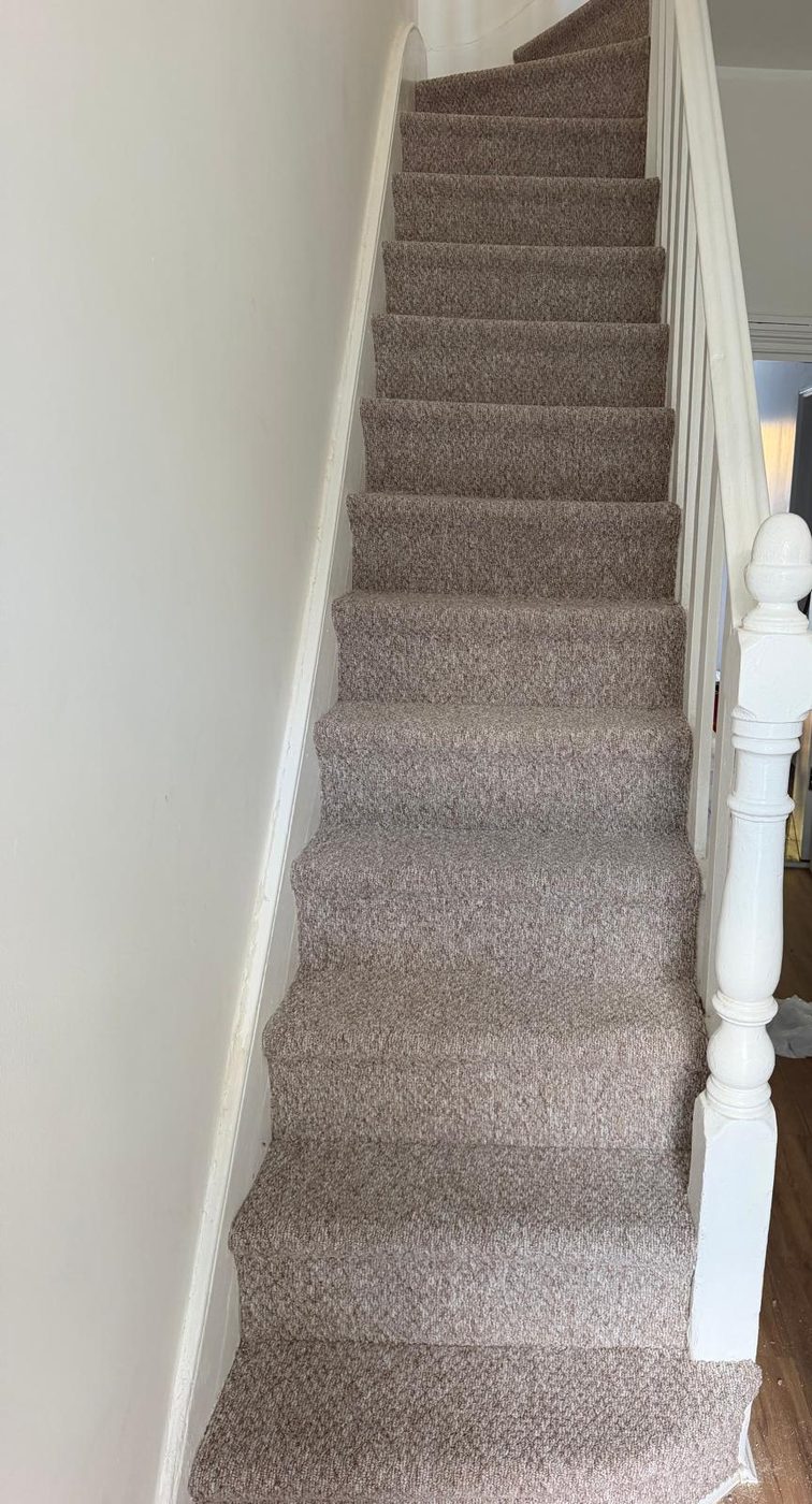 Abingdon Artemis Sandstone carpet fitted on the stairs in Leyton E10 by Carpet World London