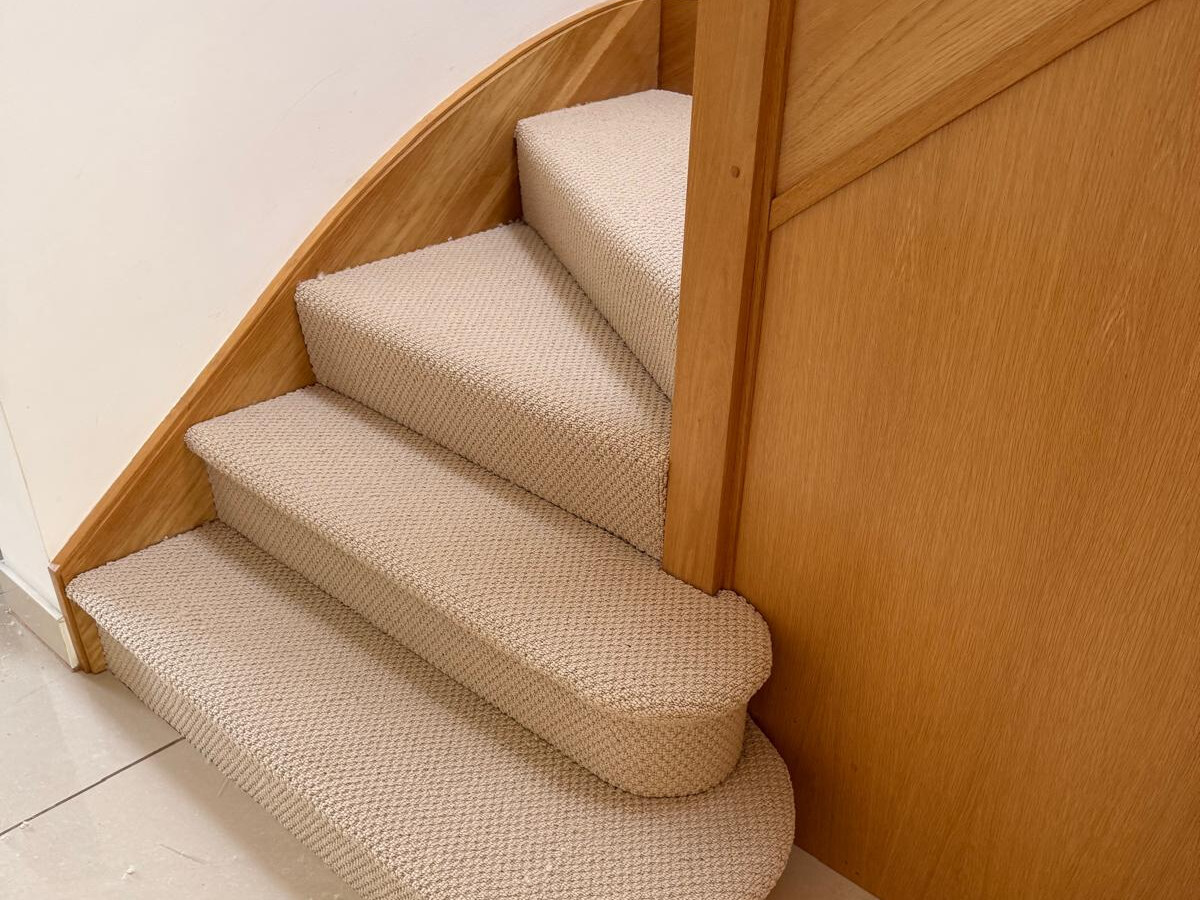 Balta Designer Style Caramel carpet on a curved staircase in Enfield EN2 by Carpet World London