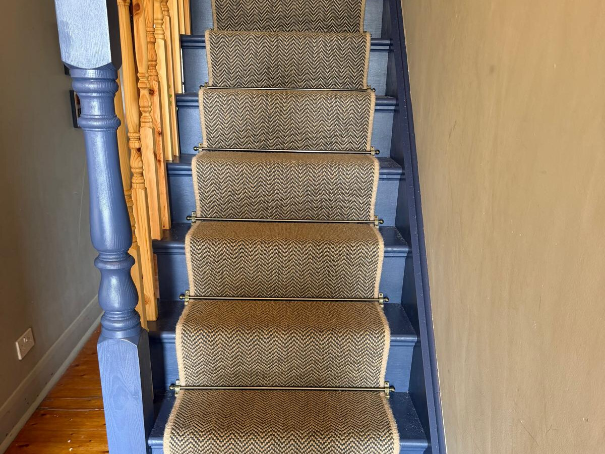 Herringbone sisal stair runner with Jubilee Bronze rods fitted in South Woodford E18 by Carpet World London